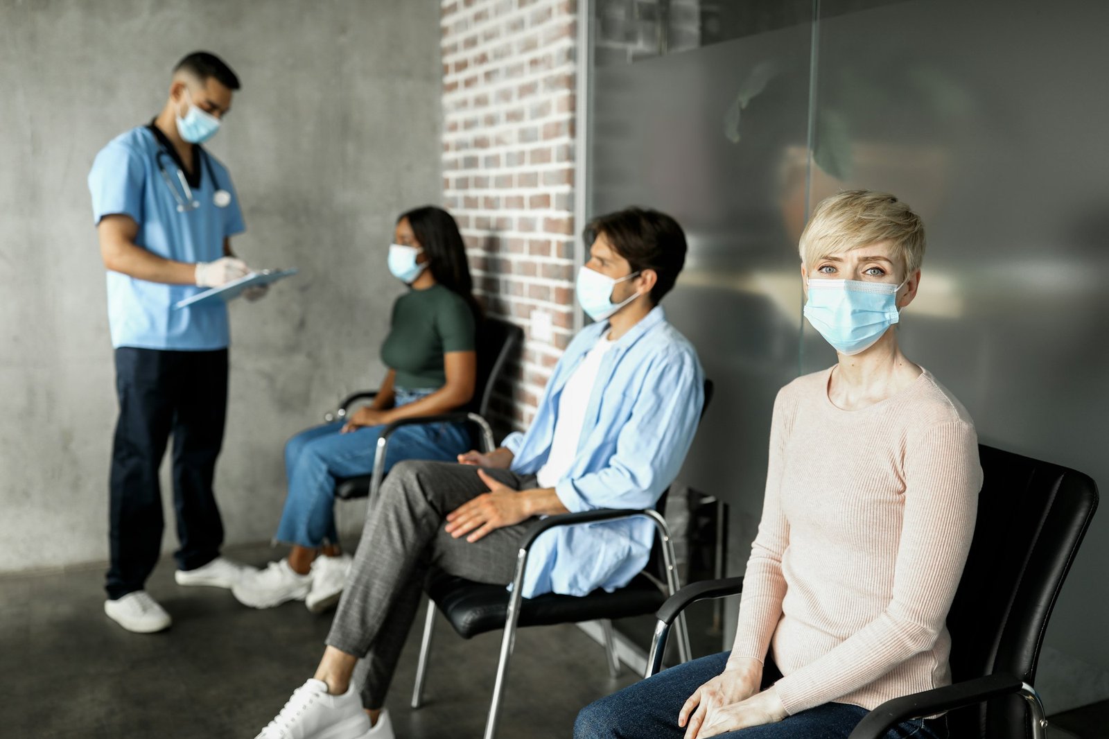 Multiracial patients waiting for vaccination against coronavirus at clinic