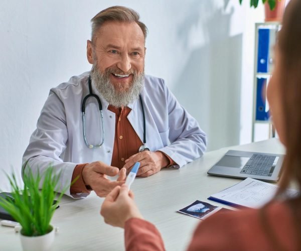 doctor showing pregnancy test doctor showing pregnancy test